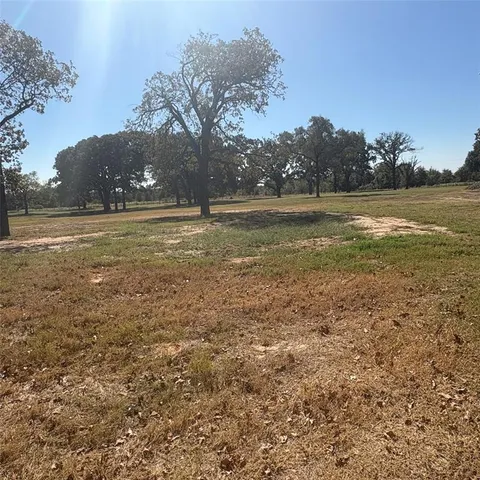 a view of a lake with a yard