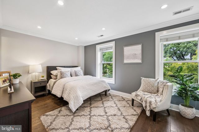 a bedroom with a large bed and a couch