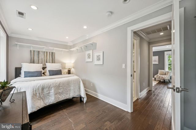 a bedroom with a bed and a view of bedroom