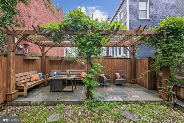 a view of a chairs and table in the patio