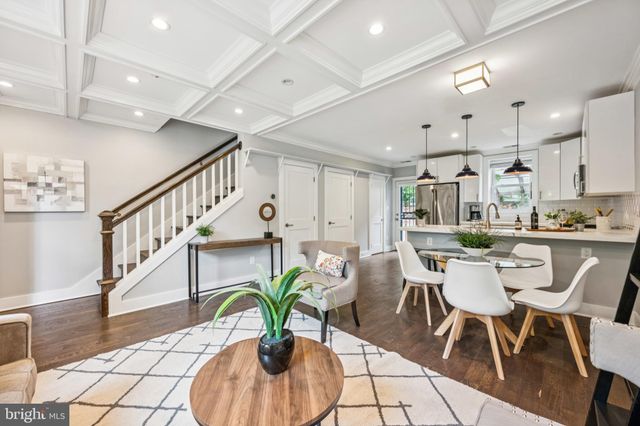 a dining room with furniture and entryway