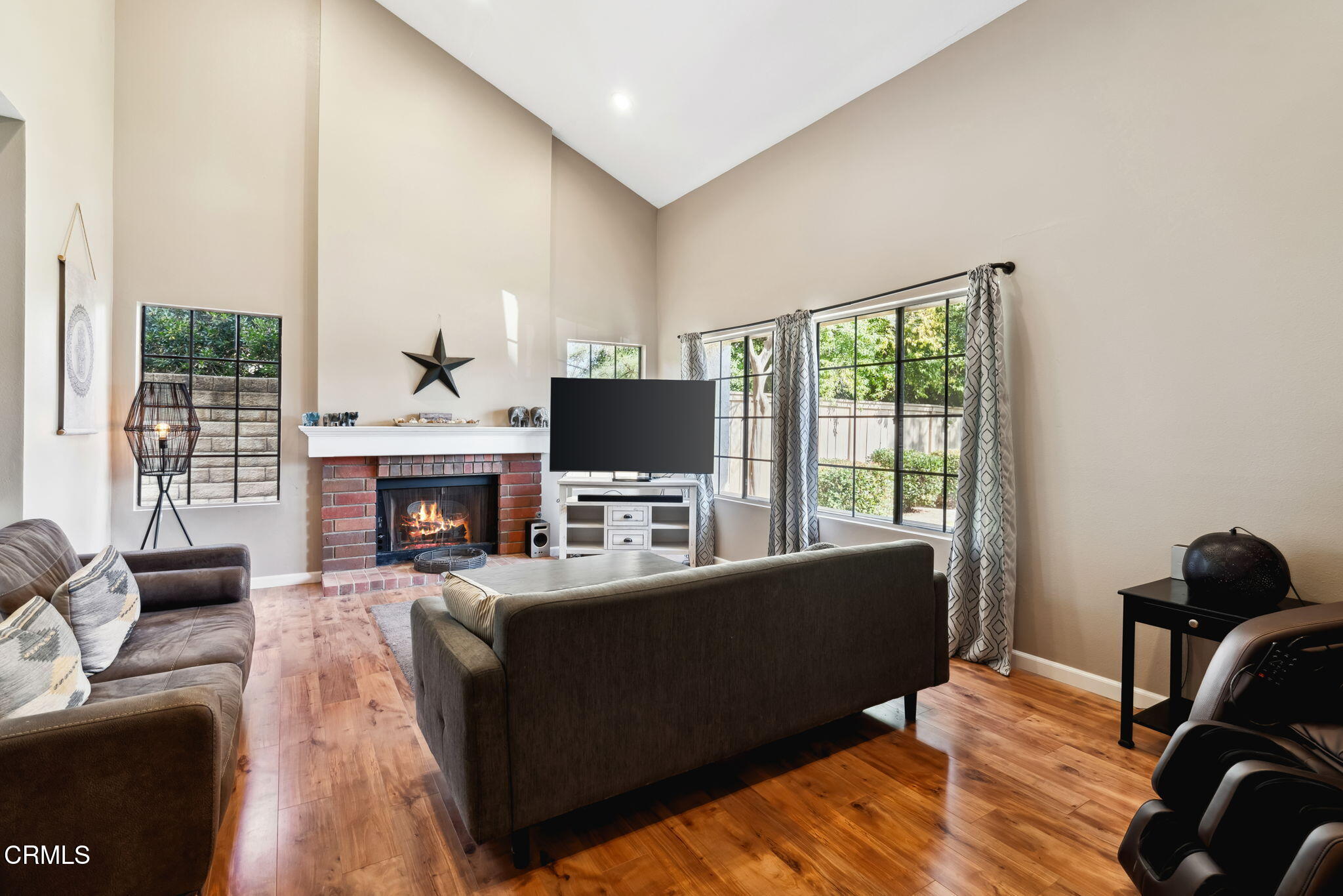 4293 Peach Slope Road Moorpark, CA 93021 - Photo 3 of 36 a living room with furniture a flat screen tv and a fireplace