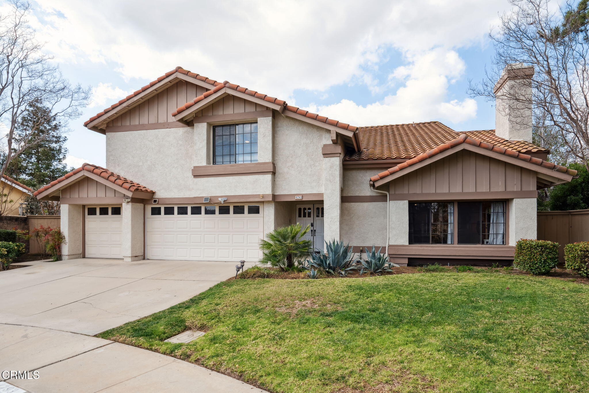 4293 Peach Slope Road Moorpark, CA 93021 - Photo 36 of 36 a front view of a house with a garden and plants