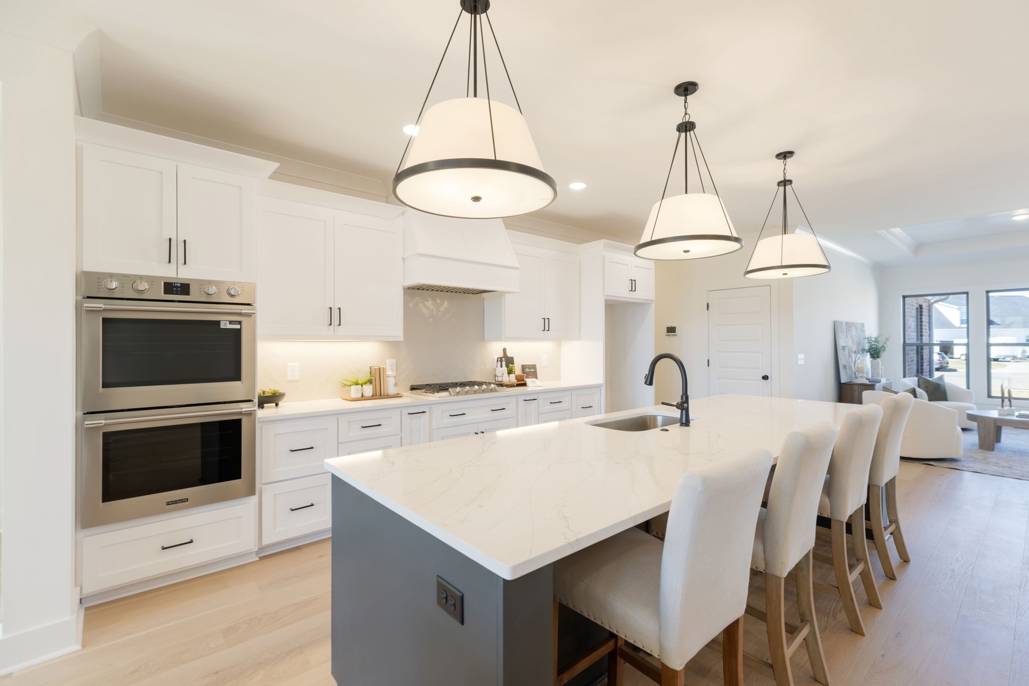 1004 Pheasant Court Spring Hill, TN 37174 - Photo 1 of 22 a kitchen with a stove a chandelier and a table