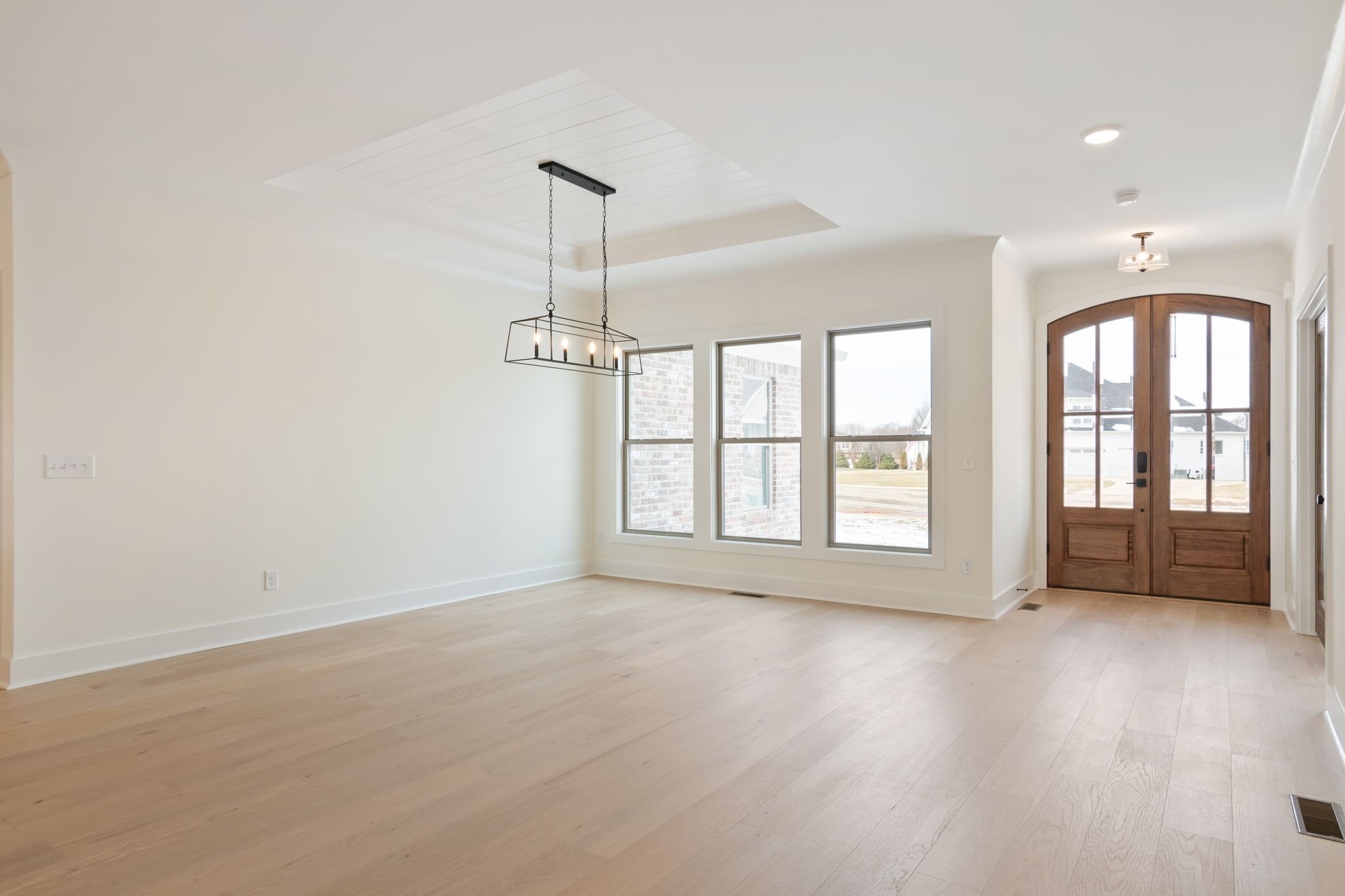 1004 Pheasant Court Spring Hill, TN 37174 - Photo 5 of 22 a view of an empty room with a window and wooden floor
