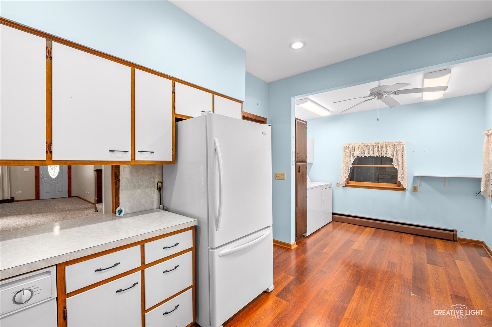 92 Maple Street Sugar Grove, IL 60554 - Photo 12 of 40 a kitchen with granite countertop a refrigerator and a stove top oven