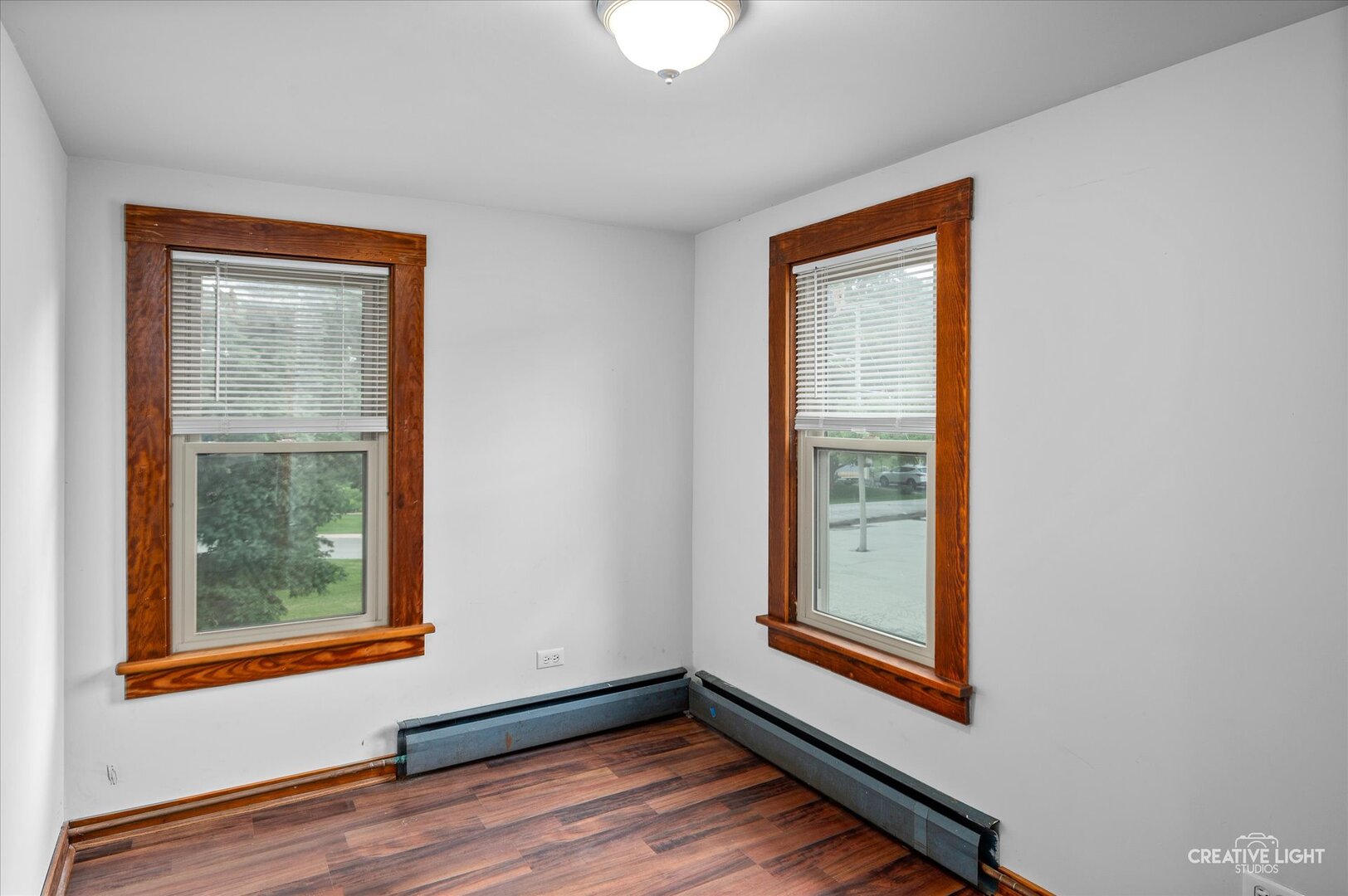 92 Maple Street Sugar Grove, IL 60554 - Photo 18 of 40 a view of an empty room with wooden floor and a window