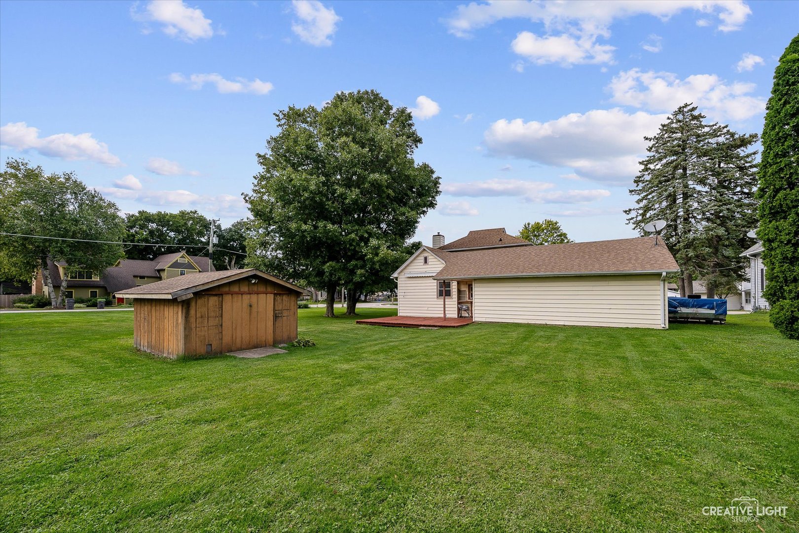 92 Maple Street Sugar Grove, IL 60554 - Photo 25 of 40 a view of a backyard with a garden and trees