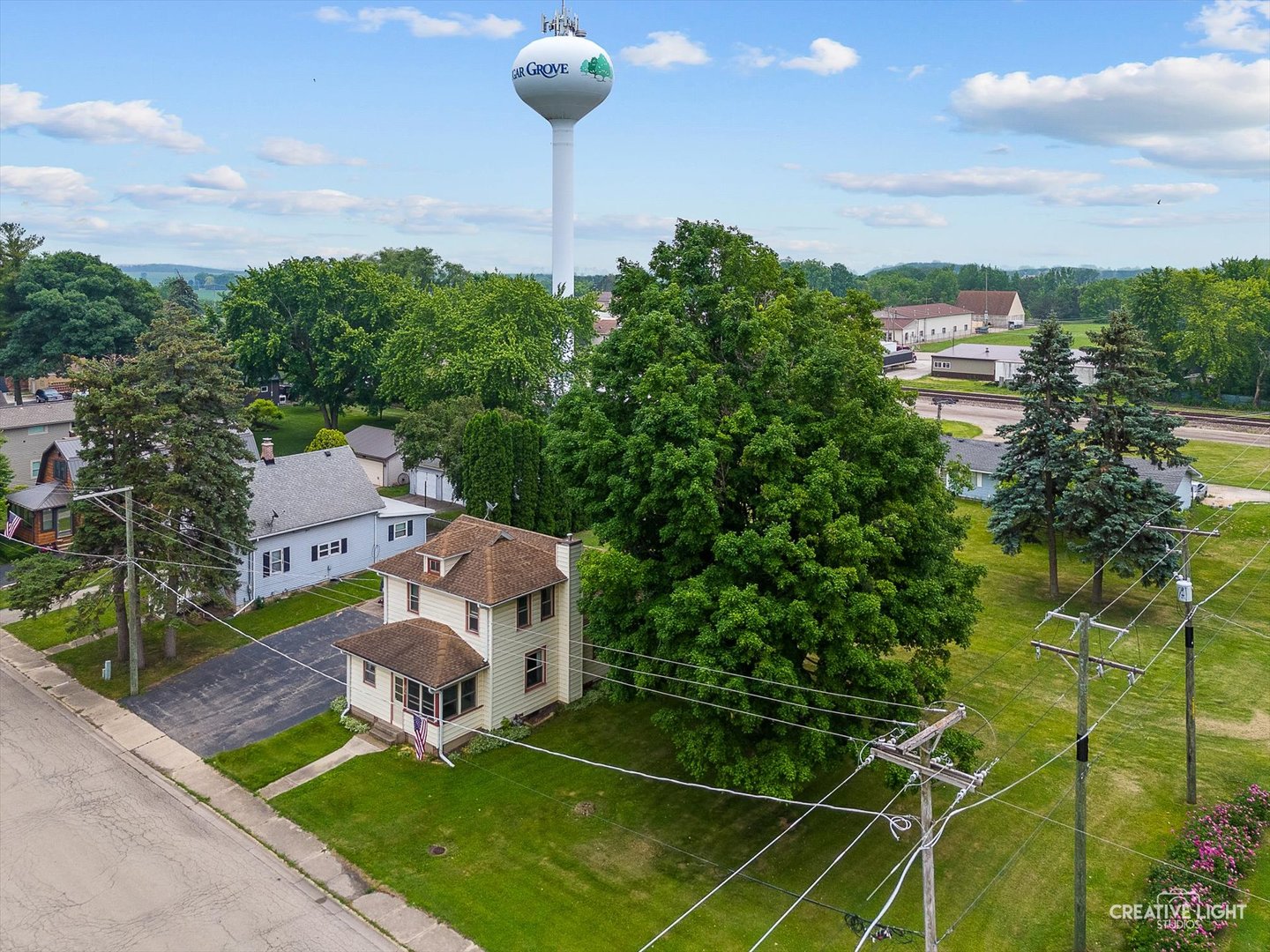 92 Maple Street Sugar Grove, IL 60554 - Photo 26 of 40 a front view of a building with garden