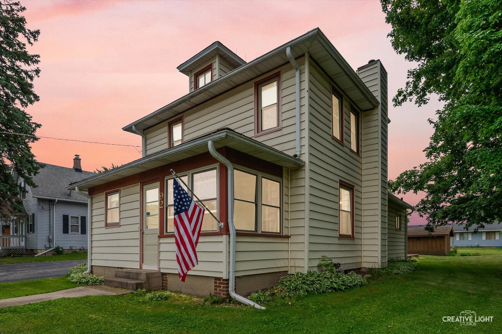 92 Maple Street Sugar Grove, IL 60554 - Photo 34 of 40 a front view of a house with a yard