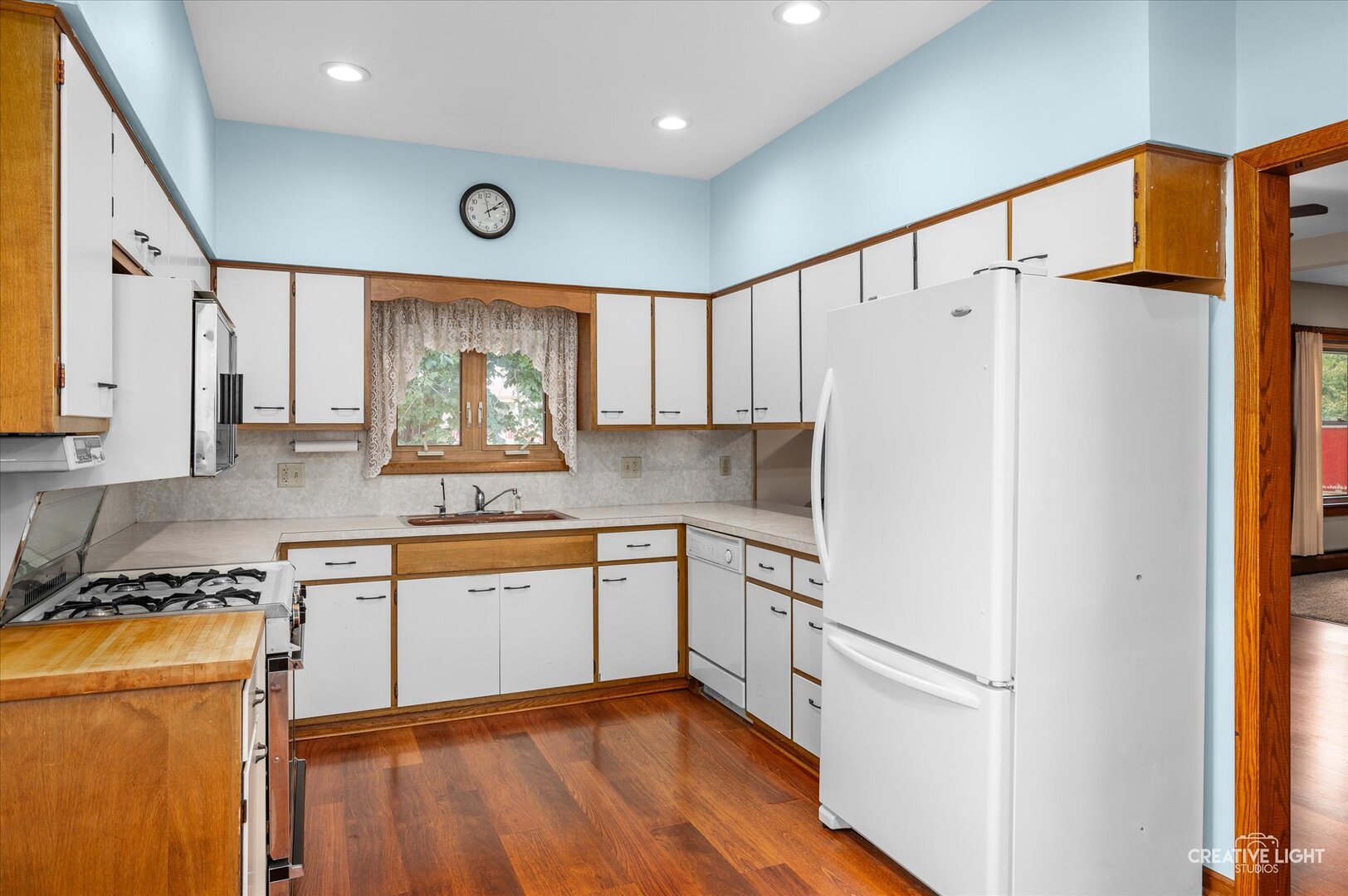 92 Maple Street Sugar Grove, IL 60554 - Photo 10 of 40 a kitchen with granite countertop cabinets stainless steel appliances a sink and a window