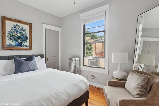 a bedroom with a bed and a couch