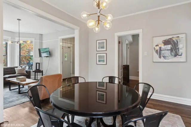 a dining room with furniture and window