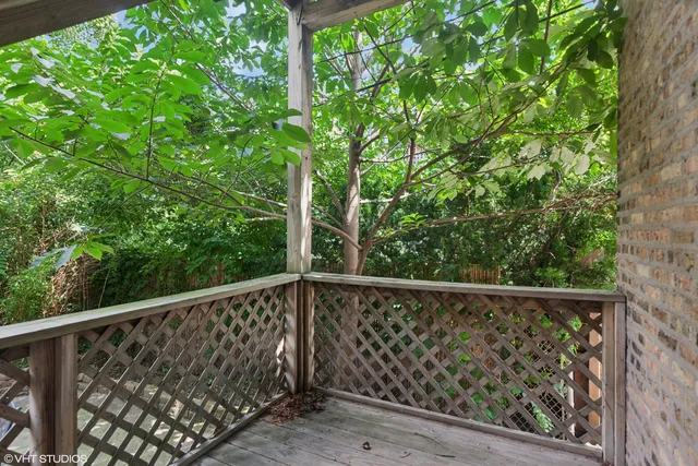 a view of a balcony with floor to ceiling window