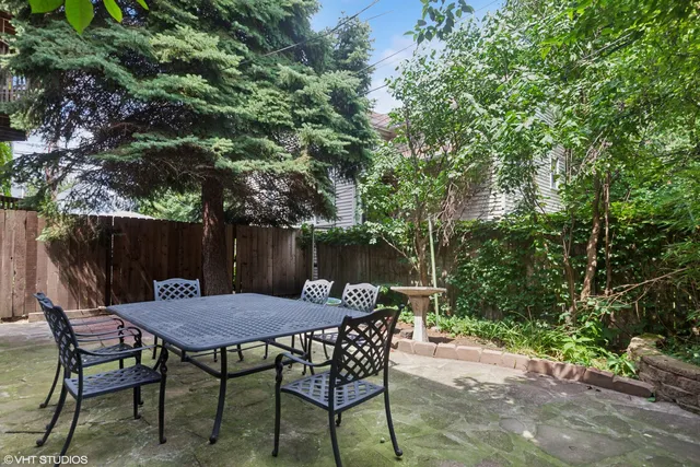a view of a table and chairs in the patio