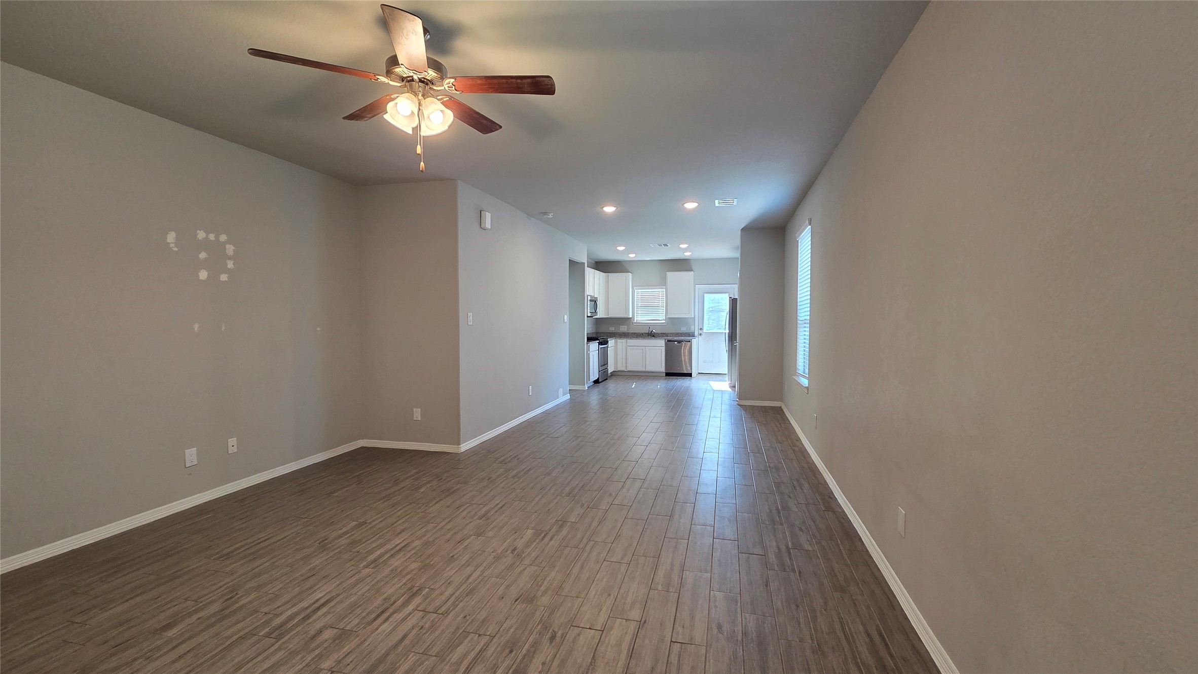 914 Redinger Ridge Drive Houston, TX 77336 - Photo 5 of 16 a view of empty room with wooden floor