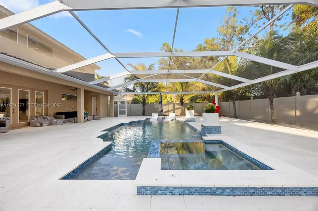 a view of a swimming pool with a patio