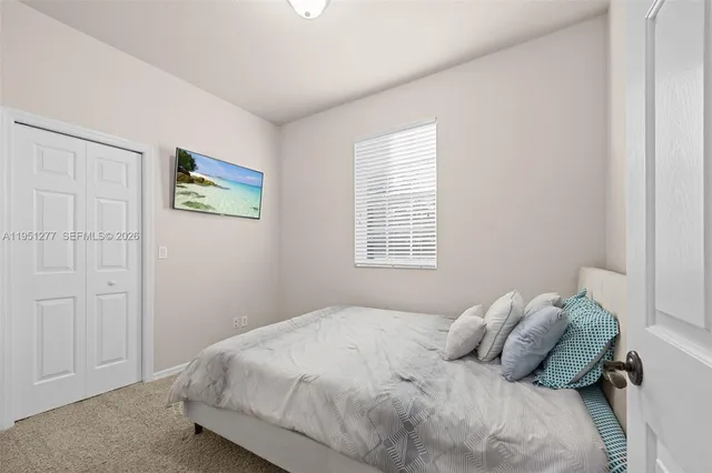 a living room with furniture and a lamp