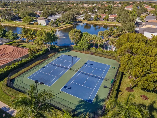an aerial view of residential houses with outdoor space