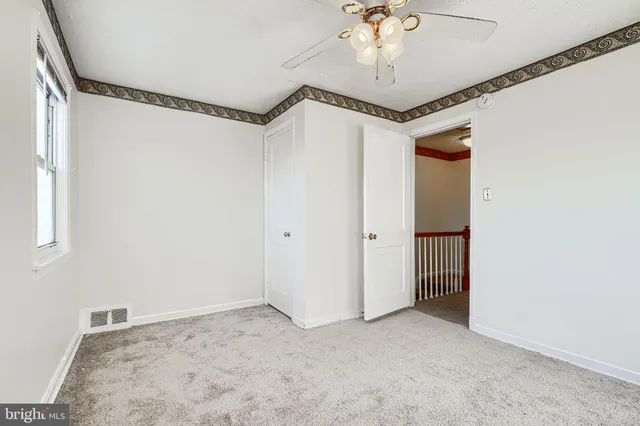 a view of a hallway with a chandelier