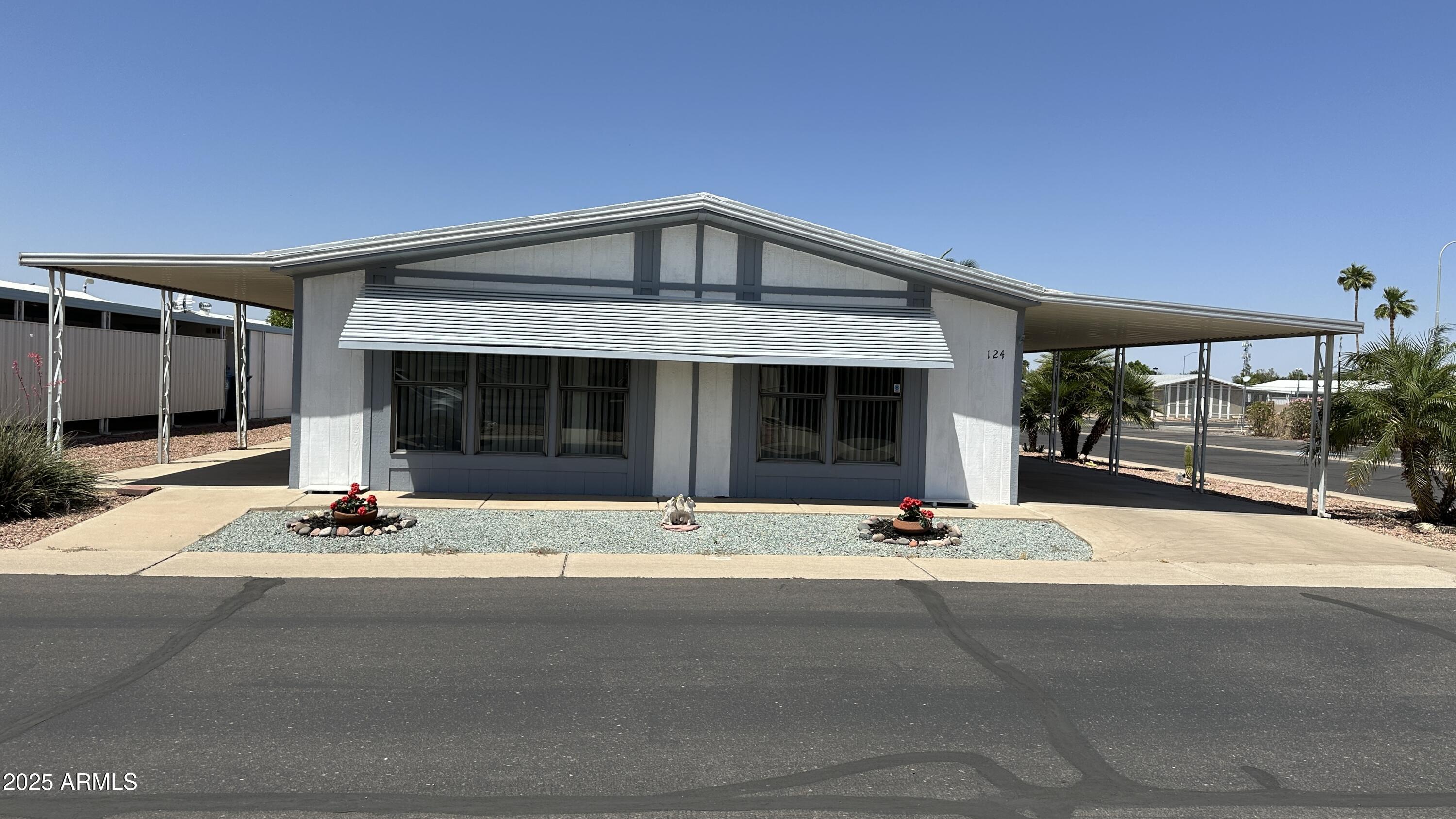 834 South Meridian Road, Unit 124 Apache Junction, AZ 85120 - Photo 1 of 28 a front view of a building with garage view
