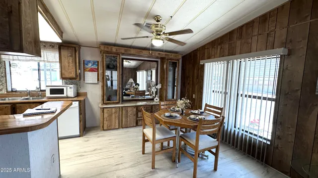 a view of a dining room with furniture window and outside view