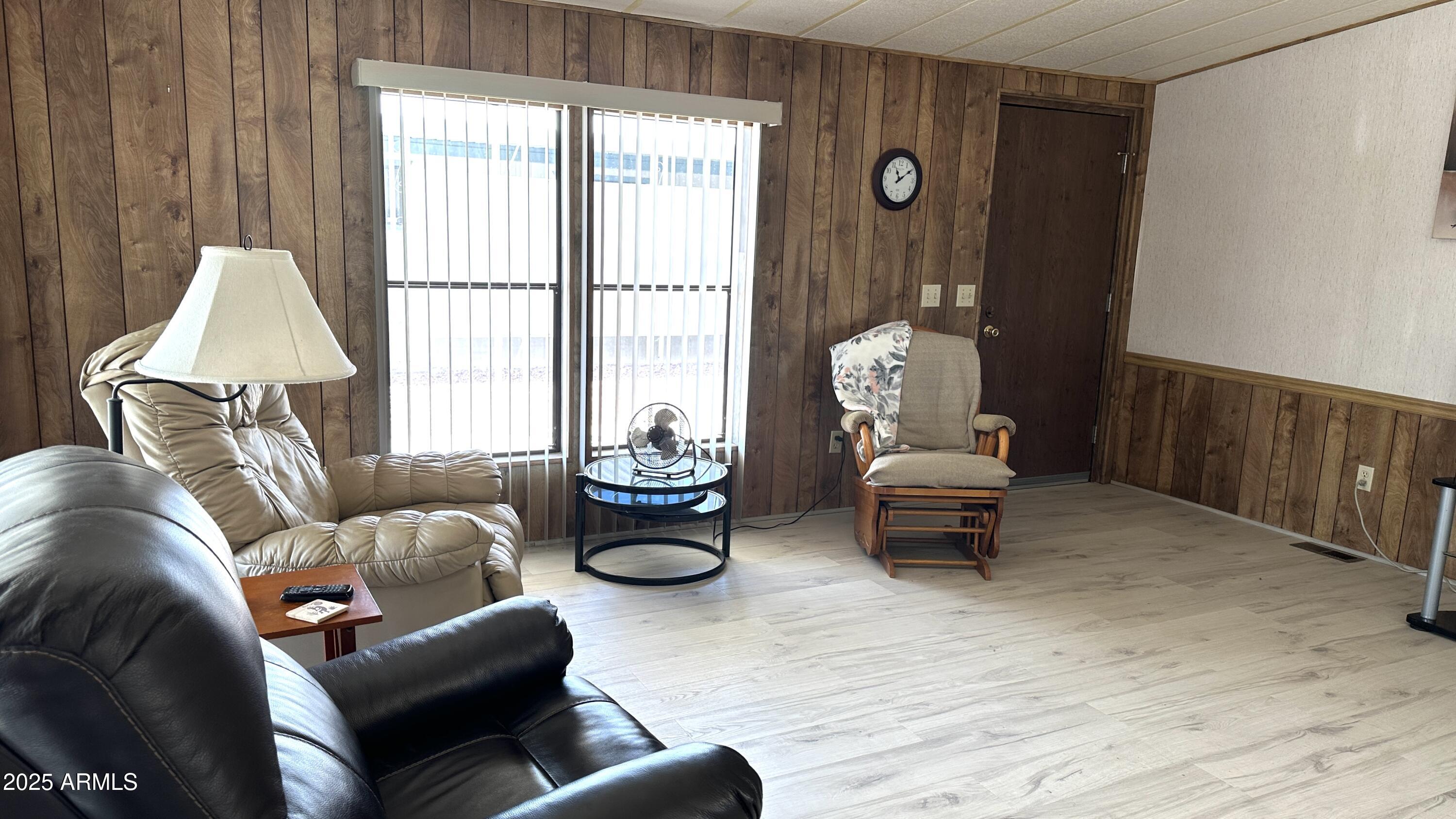 834 South Meridian Road, Unit 124 Apache Junction, AZ 85120 - Photo 13 of 28 a living room with furniture and a window