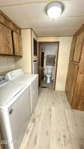 a bedroom with a bed window and a television