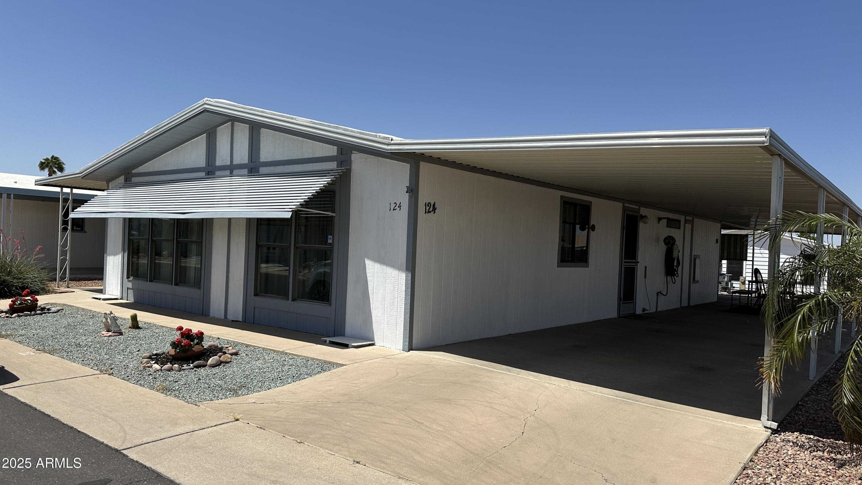 834 South Meridian Road, Unit 124 Apache Junction, AZ 85120 - Photo 2 of 28 a view of a house with backyard