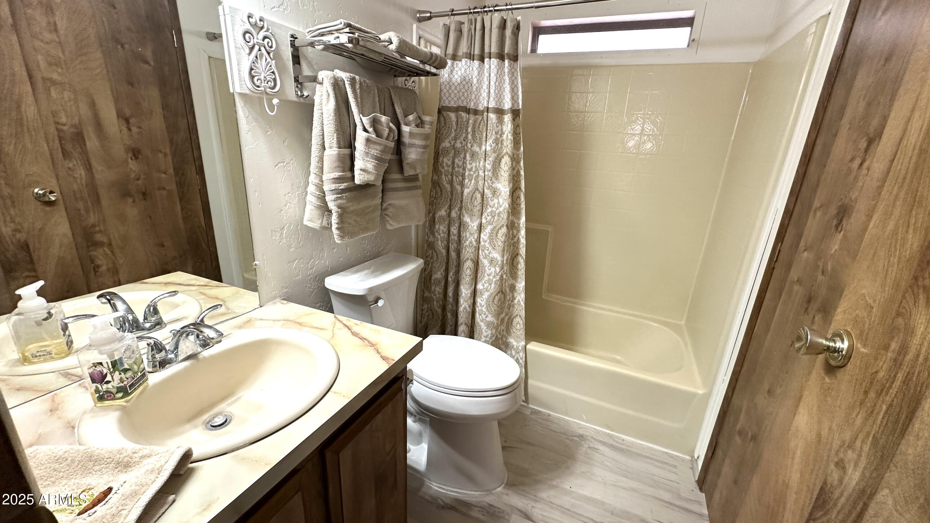 834 South Meridian Road, Unit 124 Apache Junction, AZ 85120 - Photo 26 of 28 a bathroom with a sink toilet and shower