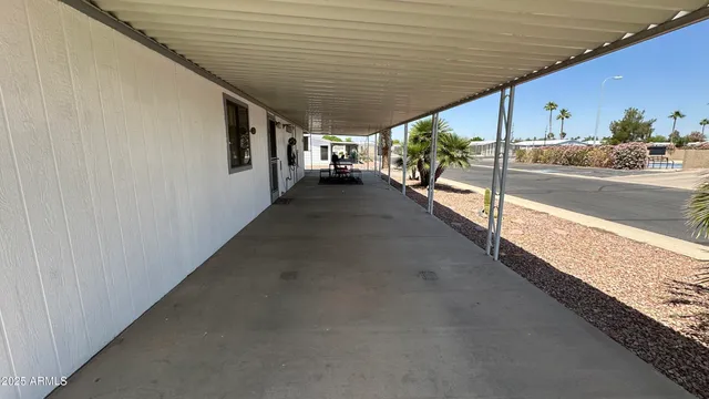 a hallway with a large stone wall
