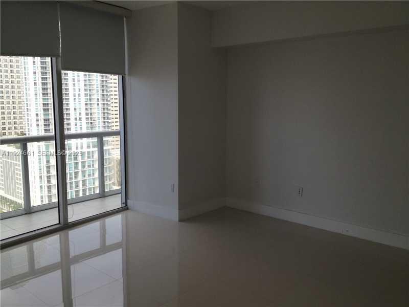 475 Brickell Avenue, Unit 2415 Miami, FL 33131 - Photo 3 of 9 a view of an empty room with a window