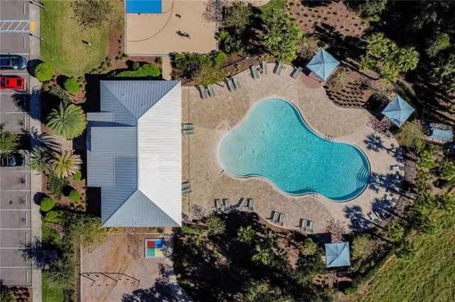 an aerial view of a house with outdoor space