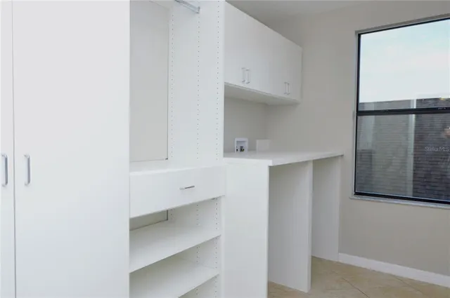 a view of an empty walk in closet