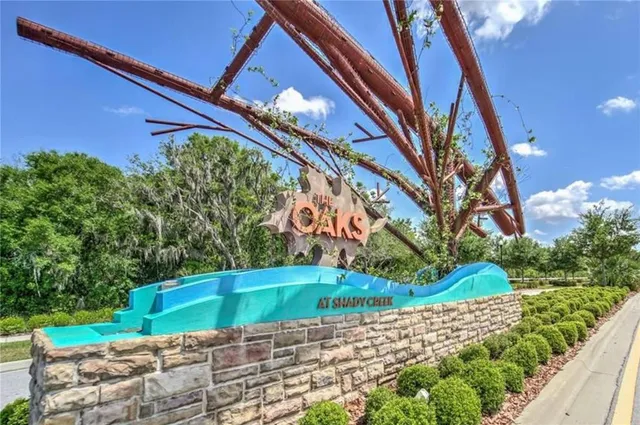 a backyard of a house with a yard and outdoor seating