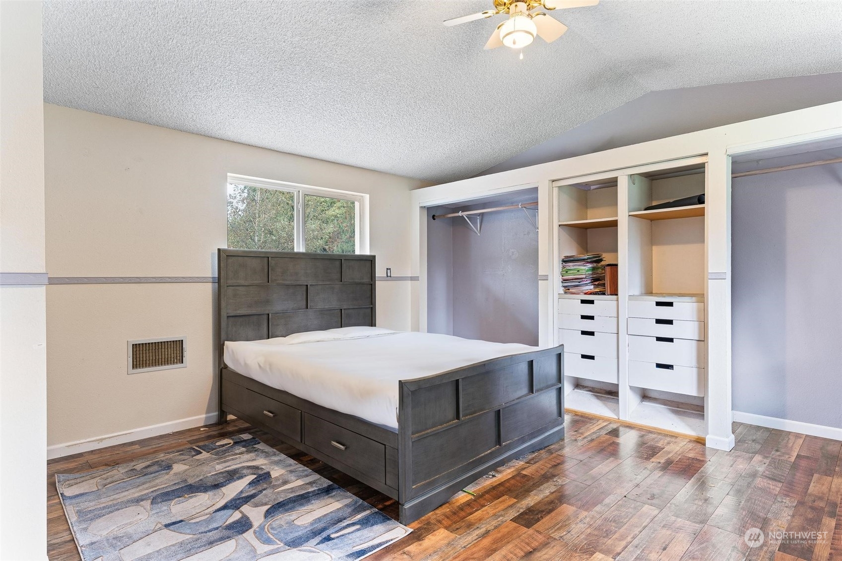 17821 Trombley Road Snohomish, WA 98290 - Photo 18 of 36 a room with a bed and a chandelier