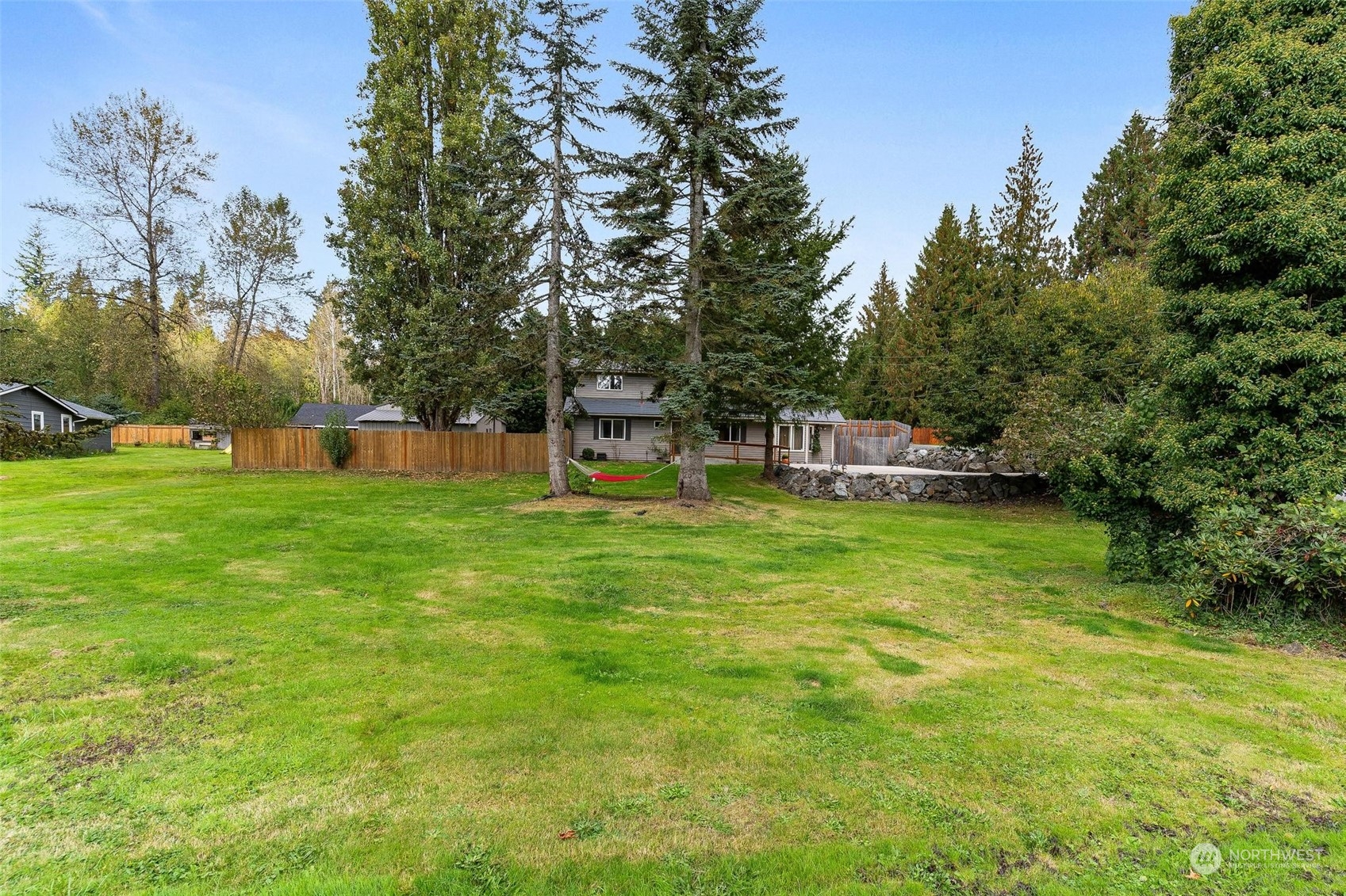 17821 Trombley Road Snohomish, WA 98290 - Photo 30 of 36 a view of a house with a big yard and sitting area