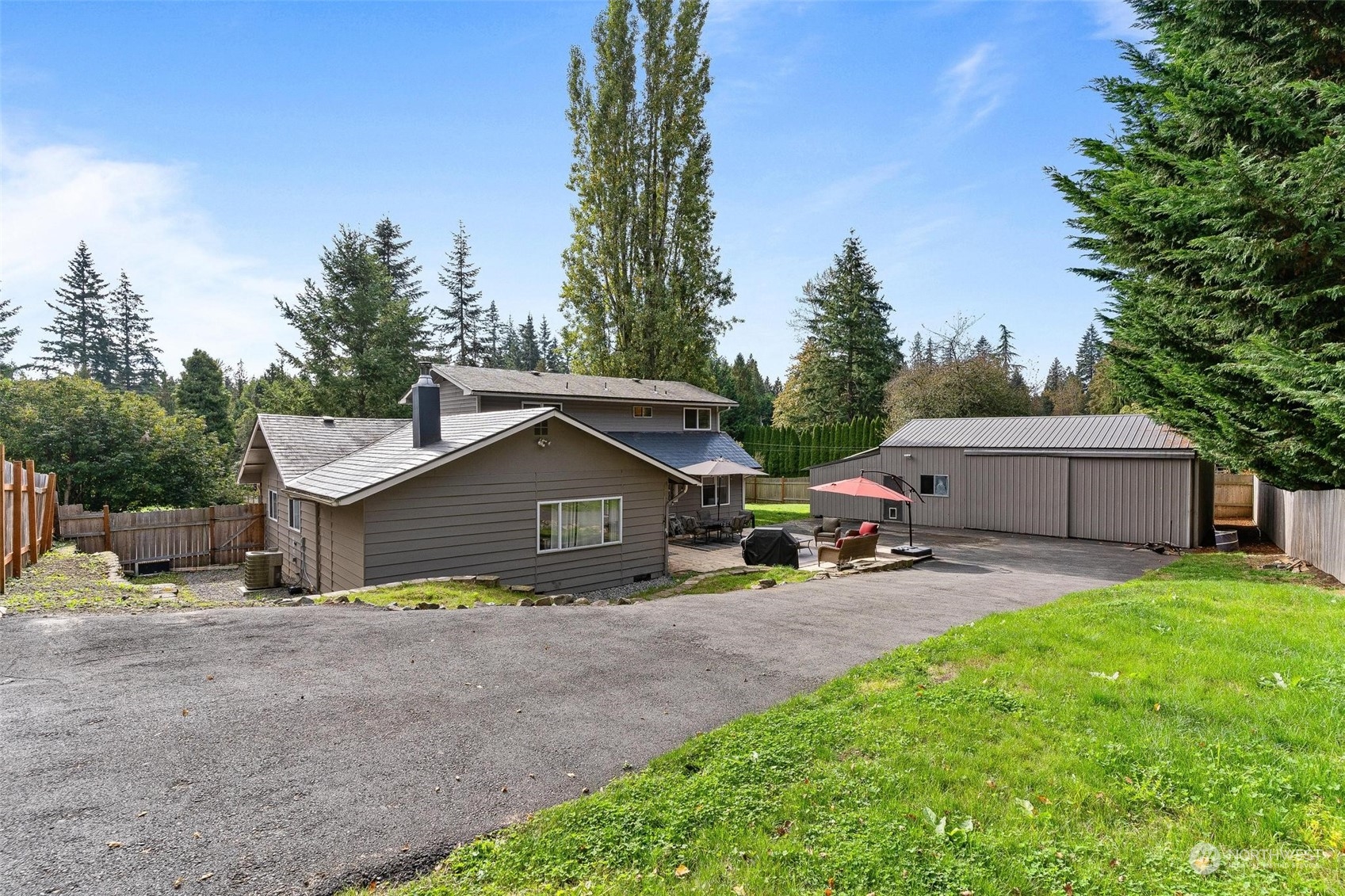 17821 Trombley Road Snohomish, WA 98290 - Photo 34 of 36 a view of a house with a yard and large trees