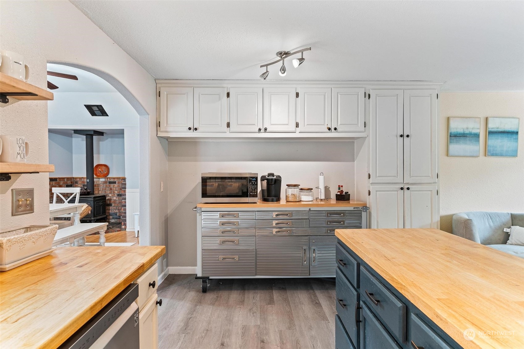 17821 Trombley Road Snohomish, WA 98290 - Photo 4 of 36 a kitchen with kitchen island white cabinets and refrigerator