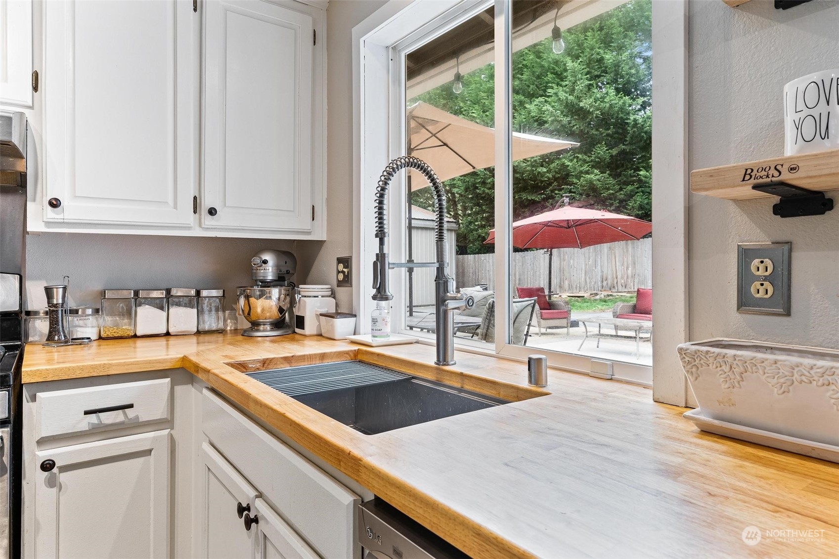 17821 Trombley Road Snohomish, WA 98290 - Photo 6 of 36 a kitchen with stainless steel appliances granite countertop a sink and cabinets