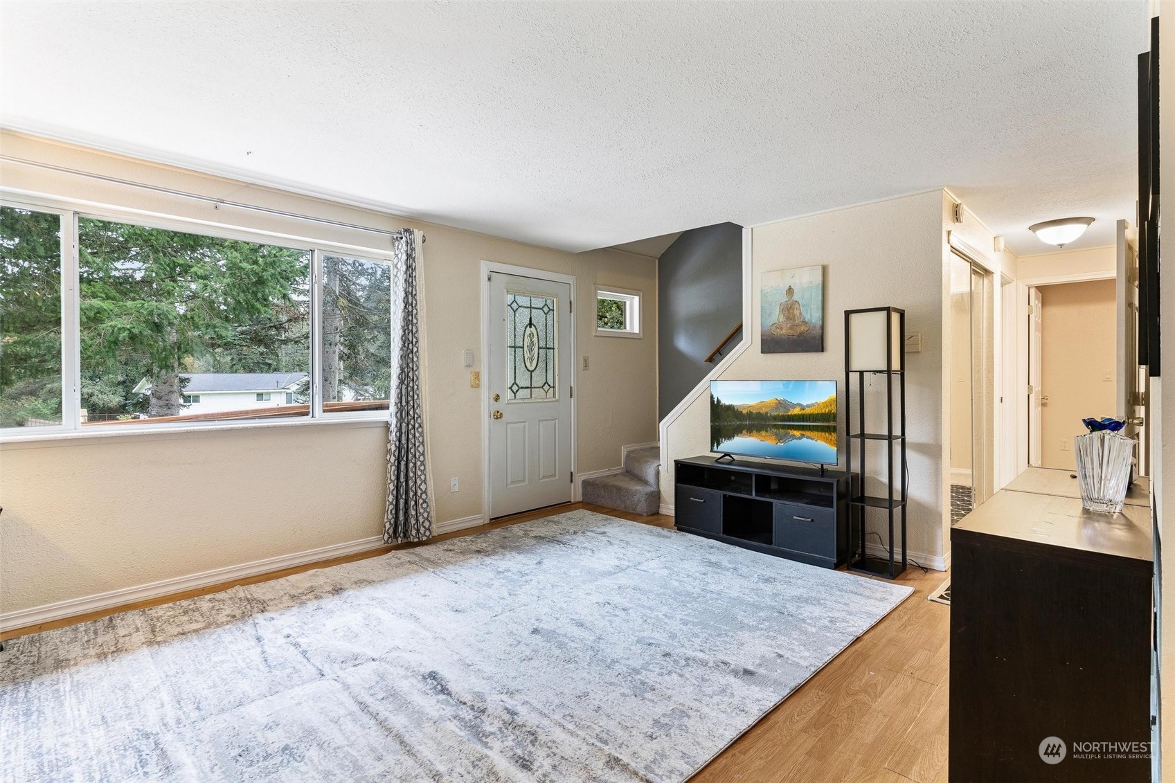 17821 Trombley Road Snohomish, WA 98290 - Photo 8 of 36 a bedroom with a bed and a dresser next to a window