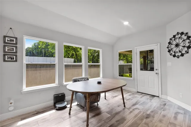 a room with stainless steel appliances furniture and kitchen view