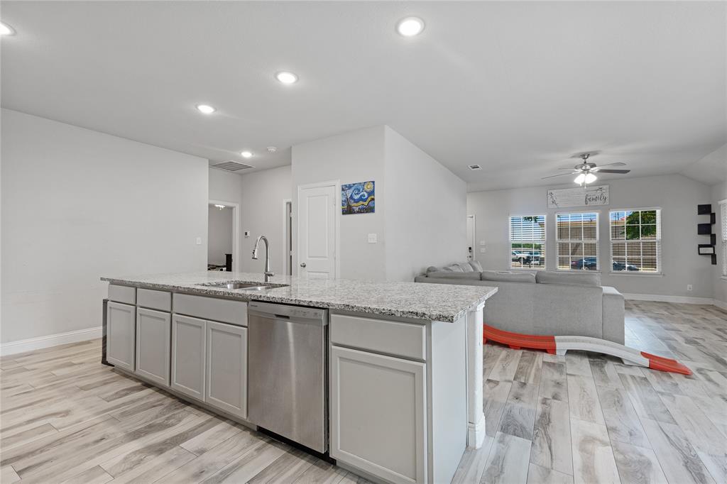 9221 White Settlement Road White Settlement, TX 76108 - Photo 18 of 30 a kitchen with sink and center island