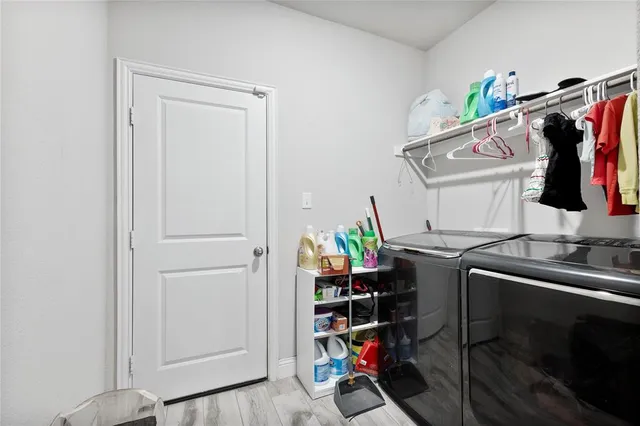 a bedroom with furniture and a flat screen tv