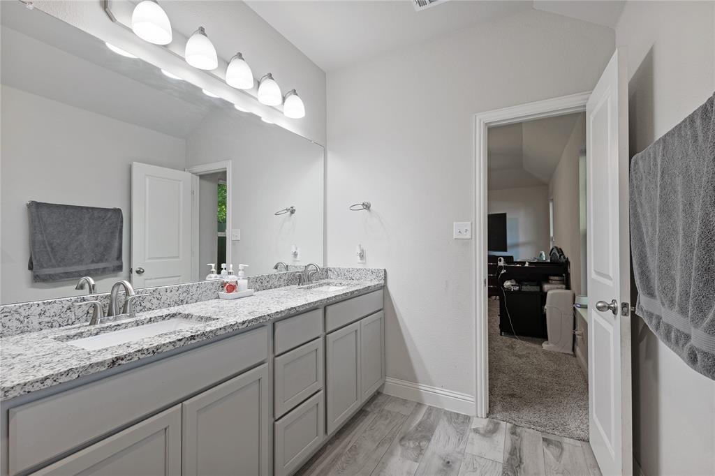 9221 White Settlement Road White Settlement, TX 76108 - Photo 26 of 30 a bathroom with a double vanity sink and a mirror