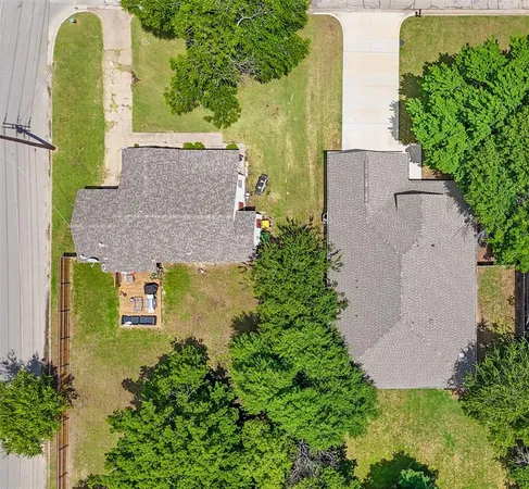 an aerial view of a house with a garden and plants