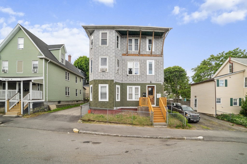 16 Barclay Street Worcester, MA 01604 - Photo 1 of 20 a front view of a house with a yard and table and chairs