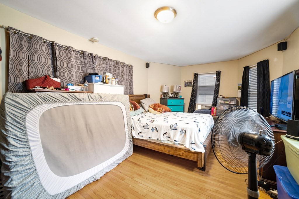 16 Barclay Street Worcester, MA 01604 - Photo 14 of 20 a bed room with a bed and a chair