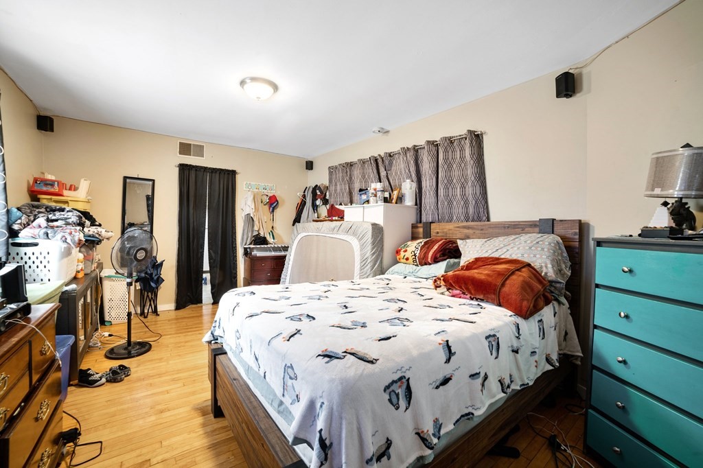 16 Barclay Street Worcester, MA 01604 - Photo 15 of 20 a bedroom with double bed and a closet