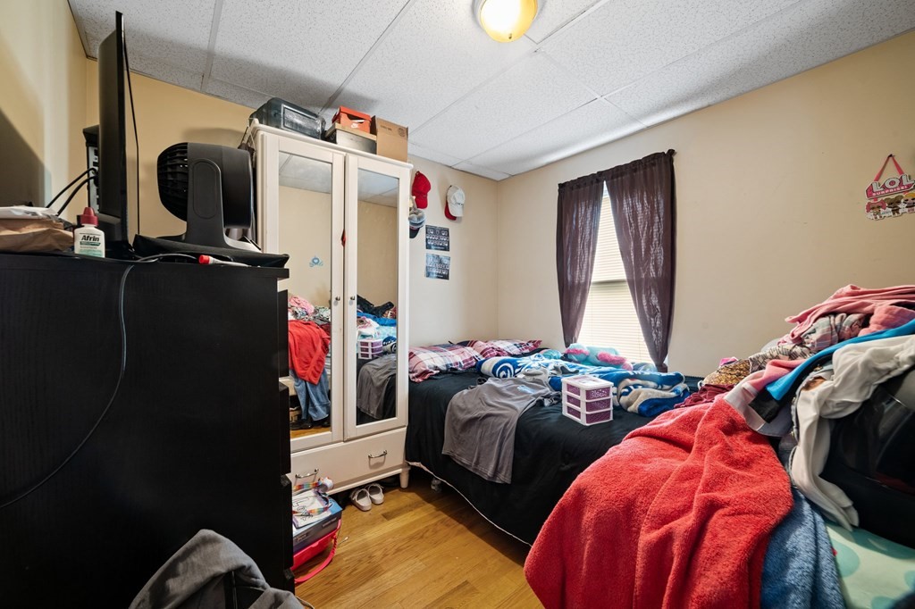 16 Barclay Street Worcester, MA 01604 - Photo 16 of 20 a bedroom with two bed and a closet